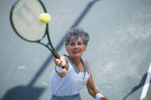 mature woman playing tennis.jpg